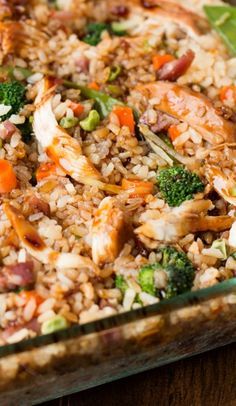 rice and vegetables are mixed together in a casserole dish, ready to be eaten