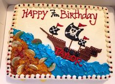 a birthday cake decorated with an image of a pirate ship