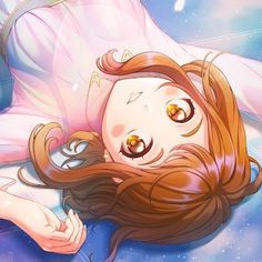 a woman laying on top of a bed next to a blue sky filled with stars