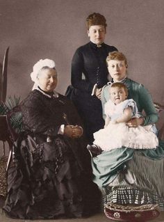 an old photo of three women and a baby