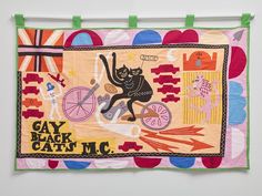 an image of a cat on a bike with the caption gay black cats mc