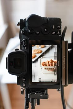 a video camera with food on the screen