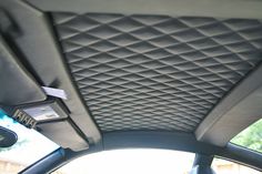 the interior of a car with an air vent and sunroofer on it