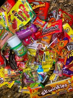 a pile of assorted candy and snacks