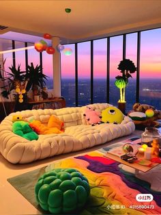 a living room filled with lots of furniture next to a window covered in colorful balloons