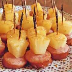 pineapple and ham bites on a plate with toothpicks