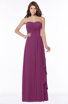 a woman in a strapless purple bridesmaid dress standing with her hands on her hips