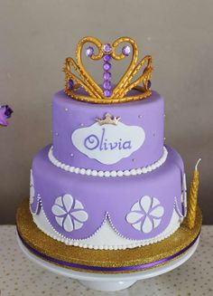 a purple and gold cake with a crown on top