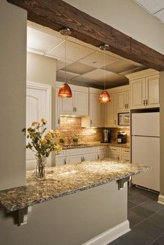 the kitchen is clean and ready to be used as a dining room or office space