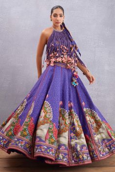 Amethyst purple lehenga with animal, floral printed motifs and lace detail. Paired with layered fringe sleeveless blouse.
Components:2
Printed
Neckline:Round
Sleeve Length:Sleeveless
Fabric:Lehenga:  Pure Cotton Silk, Handwoven Chanderi, Dupion; Blouse:  Pure Cotton Silk, Handwoven Chanderi
Color:Purple
Back tie-up
Seashell tassels
Layered fringe
Printed motifs
Lace detail - Aza Fashions Purple Silk Lehenga For Reception, Bohemian Lehenga With Printed Motifs For Reception, Designer Silk Lehenga In Purple, Purple Silk Floor-length Sets, Purple Silk Sets For Reception, Purple Bollywood Lehenga With Motifs, Bollywood Style Purple Lehenga With Motifs, Bollywood Style Purple Choli With Motifs, Bohemian Lehenga With Digital Print