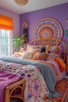 a bedroom with purple walls and colorful bedding