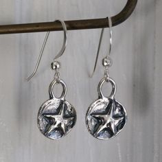 Listing Is For A Pair Of Artisan Sterling Silver Star Earrings. Handmade, Both Stars And Earring Hooks Are Solid 925 Sterling Silver. Stars Measure 16x10mm, With A 1 3/8 Inch Drop. Earrings Are Gift Wrapped In Eco-Friendly, 100% Recycled Materials That Are Recyclable Themselves. The Photo Of Me Wearing Them Is My Personal Pair, But You Will Receive A Brand New Pair. Please Feel Free To Contact Me With Any Questions Or Concerns And Thanks For Looking! :) Silver Earrings With Star Charm For Everyday, Silver Star Charm Earrings For Everyday, Handmade Star-shaped Jewelry For Everyday Wear, Handmade Star-shaped Everyday Jewelry, Sterling Silver Earrings With Star Charm, Handmade Silver Star Earrings, Nickel-free Star-shaped Earrings For Jewelry Making, Adjustable Sterling Silver Earrings With Star Charm, Star-shaped Earrings With Lever Back For Gifts