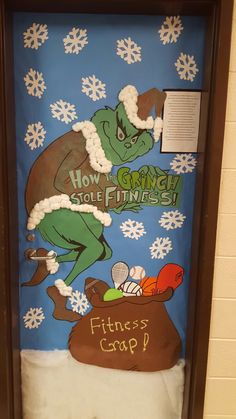 a door decorated with an image of a grino and a bag of gifts in front of snowflakes