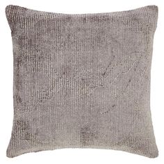 a gray and white pillow on a white background