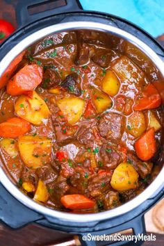 beef stew in a slow cooker with carrots, potatoes and parsley on the side