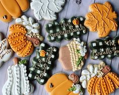 some decorated cookies are laying on a table