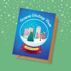 a greeting card with a snow globe on it