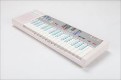 an electronic keyboard is shown on a white surface