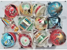 a bunch of christmas ornaments are sitting in a box