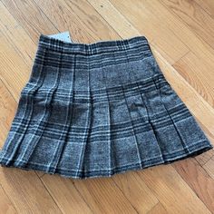 Brand New Wool Pleated Plaid Skirt With Built In Safety Shorts. The Material Is Very Well Made With A Thick Wool And It’s A Great Piece For Fall And Winter Gray Pleated Skort, Grey Pleated Short Skort, Gray Pleated Skort Of Short Length, Gray Pleated Casual Skort, Casual Pleated Gray Skort, Casual Gray Skirted Skort, Gray Pleated Mini Skort, Gray Pleated Short Length Skort, Casual Gray Short Length Skort