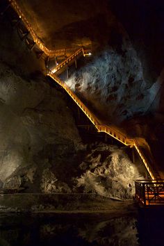 A glowing pathway leading down to the foot of a sparkling saline lake Krakow Salt Mines, Salt Mines Krakow, Endovier Salt Mines, Slanic Salt Mine, Underground City Aesthetic, Mines Aesthetic, Mining Aesthetic, Underground Temple, Underground Kingdom