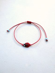 Ladybug bracelet March Bracelet Spring MARTIS Greek Bracelet, Martisor Bracelet, Martaki, Best Friend Gift Ladybird bracelet glass bead The March bracelet is an ancient Greek custom. From the beginning of March, people wear a bracelet made of white and red twisted thread. According to the tradition, the March bracelet protects those from burning of the first sun of spring. The last day of March,the bracelet is left on trees so that swallows can use it for building their nests. Bracelet is made o Adjustable Nickel-free Beaded Bracelet As Gift, Adjustable Nickel Free Beaded Bracelet Gift, Nickel Free Round Beads Friendship Bracelet, Friendship Bracelet With Sliding Knot Gift, Friendship Bracelet With Sliding Knot As Gift, Adjustable Length Friendship Bracelets As A Gift, Round Friendship Bracelet With Sliding Knot As A Gift, Adjustable Friendship Bracelet Gift, Gift Braided Bracelets With Adjustable Cord And Round Beads