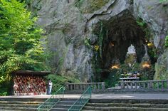 the stairs lead up to an entrance into a cave