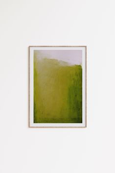 an abstract painting hangs on the wall