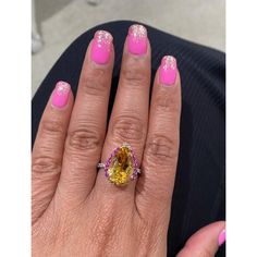 This gorgeous ring has a magnificent Pear Cut Citrine Quartz weighing 5.28 Carats and is surrounded by 25 Pink and Yellow Sapphires that weigh 0.60 carats and 20 Round Cut Diamonds that weigh 0.37 carats. (Clarity: SI, Color: F) The total carat weight of the ring is 6.25 carats. Each stone is handpicked and carefully curated to create a unique piece by our in-house designer and jeweler! The Citrine measures approximately at 11 mm x 16 mm. It is set in 14K White Gold and weighs approximately 3.8 Luxury Multi-stone Yellow Gemstones, Luxury Yellow Multi-stone Gemstones, Luxury Yellow Pear-shaped Ring, Luxury Multi-stone Yellow Diamond Ring, Luxury Yellow Gemstones With Accent Stones, Formal Yellow Multi-stone Diamond Ring, Luxury Yellow Sapphire Multi-stone Ring, Elegant Yellow Sapphire Multi-stone Jewelry, Yellow Multi-stone Diamond Ring Fine Jewelry