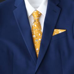 Message seller for a free swatch. Color:  Marigold Yellow Floral Material:  Cotton Adult Skinny Necktie:  approx. 2.25 inches wide and 58 inches long Adult Extra Long Tie (Big & Tall) :  approx. 2.25 inches wide and 63 inches long Adult Pre-Tied Bow Tie: approx. 4.75 inches wide by 2.5 inch height Necksize 11.5 inches - 20 inches     Metal clasp for secure and comfortable wear. Child Pre-Tied Bow Tie:  approx. 4 inches wide and 2 inch height Necksize 11 inches - 19 inches    Plastic clasp for ea Fitted Yellow Suit For Wedding, Yellow Fitted Wedding Suits, Fitted Yellow Wedding Suits, Classic Yellow Wedding Tie, Blue Suit Men, Marigold Yellow, Wedding Tie, Yellow Tie, Pre Tied Bow Tie