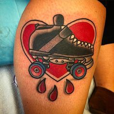 a tattoo with a skateboard in the shape of a heart and raindrops