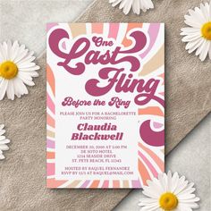 a pink and orange party card with daisies on the side, next to some white flowers