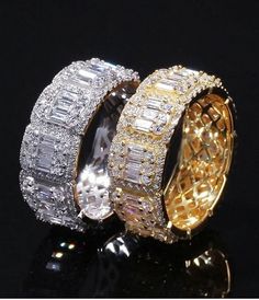 three different colored rings with diamonds on top and bottom, one in gold and the other in silver