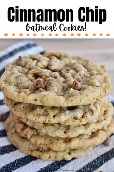 a stack of cookies sitting on top of a blue and white striped towel with the words cinnamon chip oatmeal cookies