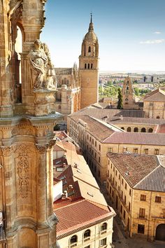 an aerial view of the city with many old buildings and statues on it's sides