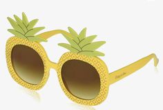 a pair of yellow sunglasses with pineapples on them