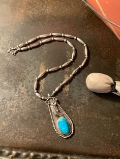 "This is one gorgeous Navajo sterling silver turquoise pendant bench bead necklace. The look is rustic yet classyGood weight to the pendant so it drapes nicely around the neck. No markings. Bench bead length is 21 inches. Pendant height is 2 7/8 inches. Pendant width is 1 1/8 inches. Total weight is 29 grams. Buy it before it's gone Jewelry has been one of the most sacred parts of Navajo culture and continues to hold much significance in the modern times as well. It is believed that they learnt Artisan Turquoise Necklace With Polished Sterling Silver Beads, Artisan Sterling Silver Turquoise Necklace With Polished Beads, Bohemian Turquoise Necklace With Sterling Silver Clasp, Turquoise Sterling Silver Necklace With Silver Beads, Turquoise Sterling Silver Jewelry With Silver Beads, Silver Turquoise Necklace With Polished Beads, Artisan Silver Beaded Turquoise Necklace, Gift Polished Beads Turquoise Necklace, Sterling Silver Turquoise Necklace With Polished Beads