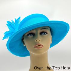 Turquoise Felt Hat for Church or Special Event  The Hats and Fascinators on this web page are made by me in my studio outside of Nashville, Tennessee. I use the age-old technique of hand blocking the millinery material over wooden blocks. I wire the edge of the brim to maintain the shape and add stability. Many of the silk flowers are hand tooled. I use high quality products many of which are purchased internationally. I love to make sinamay, felt, and fabric hats. I use silk linings, and silk f Adjustable High Crown Blue Costume Hats And Headpieces, Turquoise Short Brim Hat, Adjustable Blue Hats For Church, Turquoise Wide Brim Hat For Kentucky Derby, Turquoise Hats With Short Brim, Adjustable Blue Hat For Church, Blue Adjustable Hat For Church, Blue High Crown Hat With Adjustable Fit, Adjustable High Crown Blue Hat