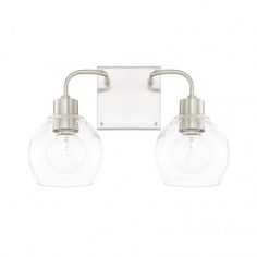 two light bathroom fixture with clear glass globes on the front and back of it