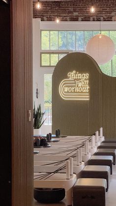 the inside of a restaurant with tables and benches in front of large windows that say thanks work out