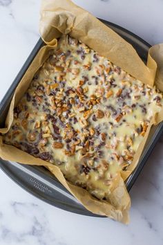 a pan filled with food sitting on top of a counter