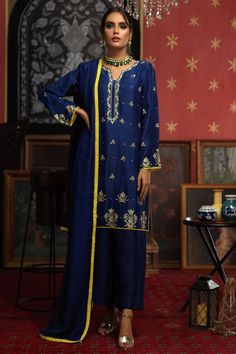 Regal royal blue silk kurta paired with straight palazzo bottoms, creating a sophisticated ensemble Dupatta adorned with vibrant contrast yellow piping along all four sides, enhancing the overall appeal Needle and thread work intricately embellished on the flair of the kameez, sleeves, and neckline for a touch of elegance Delicate pearl and zari detailing further enriching the kameez, adding a luxurious and refined texture Slit sleeves and neckline for a modern and stylish silhouette, blending t Straight Kurta With Pants, Kurta Sets For Women, Zardosi Embroidery, Eid Outfits, Boutique Suits, Indian Wedding Wear, Silk Kurta, Pakistani Dress, Suit Design