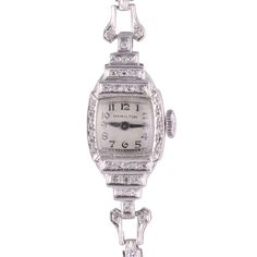 American Vintage Hamilton ladies diamond platinum wrist watch, circa 1940. This Hamilton watch features a platinum case and bracelet, along with the original silver dial and a 17 jewel manual movement #493919. Dimensions 33.4mm H point to point x 14mm W excluding crown; 5″ wrist Warranty This watch comes with a full 18 month warranty from the date of purchase. Item #SSHO 986 Silver Platinum Watch Accessories For Formal Occasions, Formal Silver Platinum Watch Accessories, Classic Silver Diamond Watch With 17 Jewels, Antique Platinum Silver Jewelry And Watches, Vintage Silver Jewelry And Watches With Single Cut Diamonds, Classic Silver Watches With Single Cut Diamonds, Antique Platinum Watches Suitable For Gifts, Vintage Watches With Diamond White Color And Hour Markers, Vintage Watches With Diamond Hour Markers In Diamond White