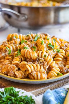 one pot enchilada pasta on a plate with parsley