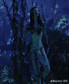 an alien woman standing in the woods at night