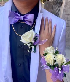 matching corsage and boutonnière with white roses, lavender ribbon, and baby’s breath Rapunzel Quinceanera Chambelanes, Chambelan Purple Suit, Purple And White Corsage And Boutonniere, Lavender Floral Prom Dress, Purple Quinceanera Suits, Light Purple Quinceanera Chambelanes, Quinceanera And Main Chambelan, White And Purple Prom Couple, Main Chambelan Outfits Purple