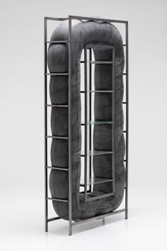 an object made out of two tires and some shelves with glass shelves on each side