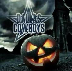 a jack - o'- lantern pumpkin with the words dallas cowboys carved into it