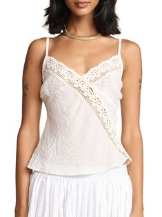 This classic cami effortlessly combines comfort and style, providing a soft and breathable fit for all-day wear. A fun summer twist on our classic Rio Camisole with sheer cotton gauze cups. 100% rayon body, 100% cotton lace and chest Made in Los Angeles Save Energy: cold water wash and air dry (or tumble dry low) Rishika is 5'9 and wears a X-Small Spring V-neck Lace Top With Delicate Straps, Cotton Tops With Built-in Bra For Daywear, Summer Lace Camisole, Bra-friendly, Summer Lace Camisole Bra Friendly, Summer Lace Camisole With Bra-friendly Design, Summer Lace Bra-friendly Camisole, Cotton Camisole With Built-in Bra For Vacation, Chic Cotton Camisole With Built-in Bra, Chic Lace Top Camisole For Daywear