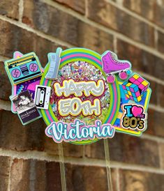 there is a sign that says happy 50th victoria and other stickers on it